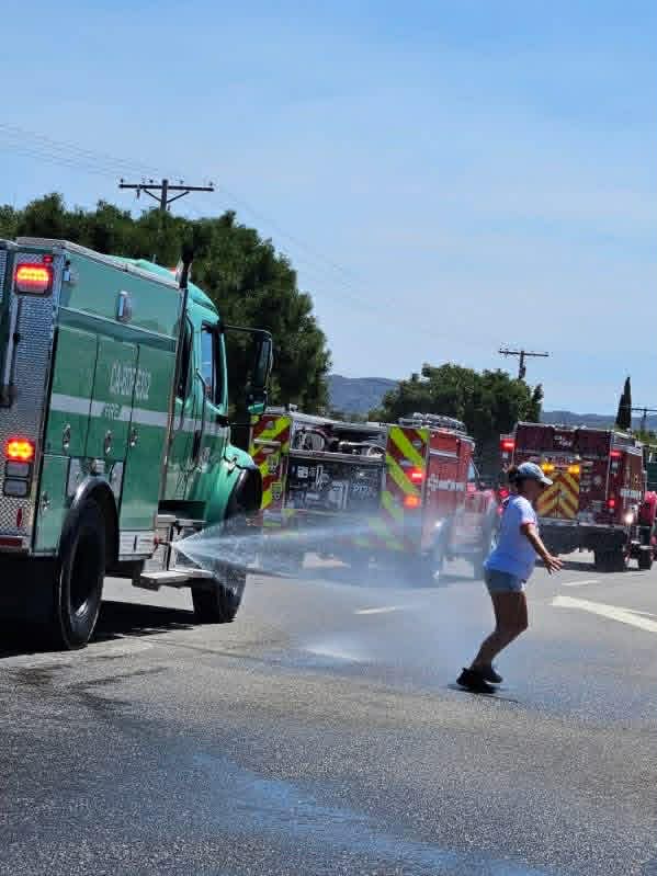 Fire trucks spraying water during the parade